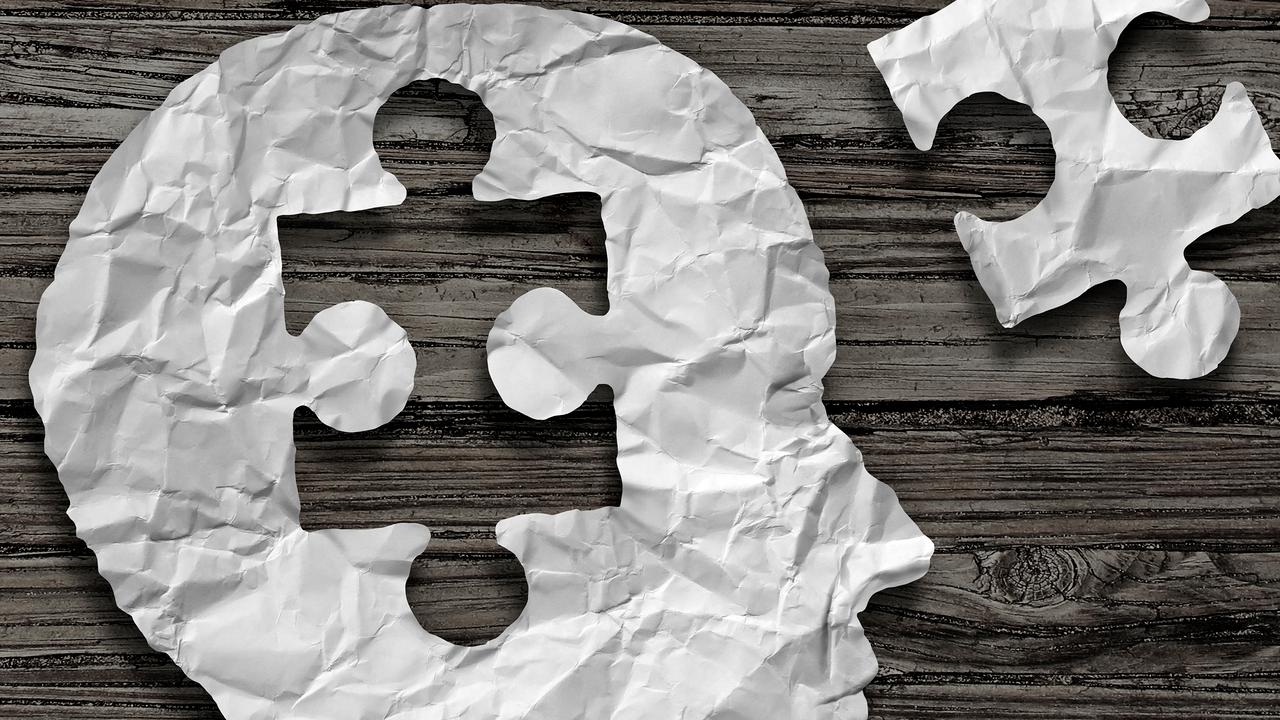 Genrebild på ett huvud i profil i papper där en pusselbit från hjärnan plockats ut och ligger bredvid. Kan illustrera sådanat som har med hjärnan att göra såsom intelligens, minne eller hjärnsjukdom.