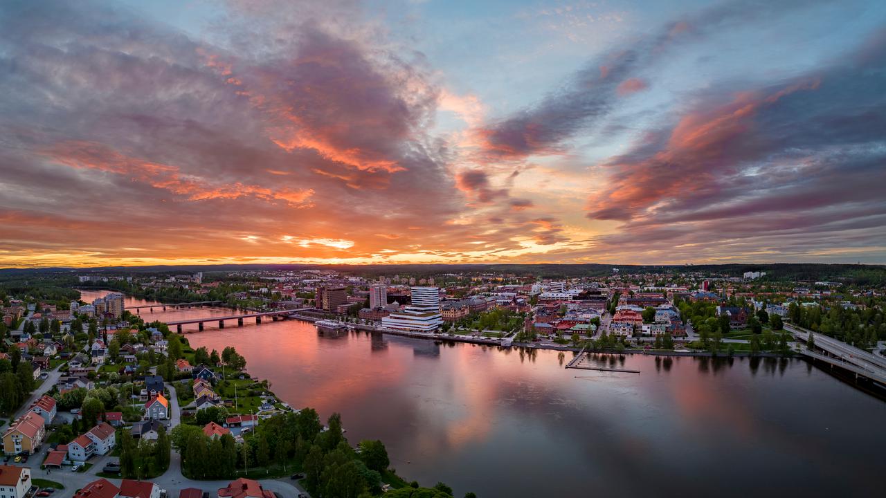 Overhead view of Umeå with a pink twilight sky.