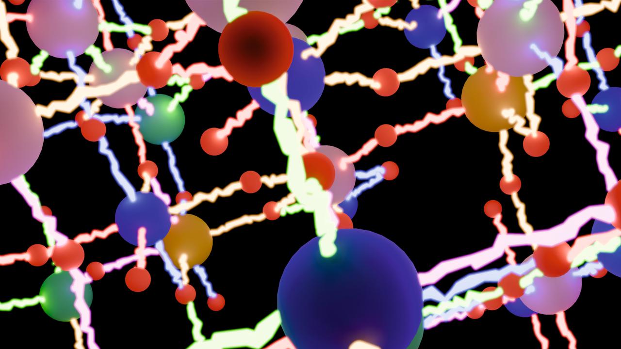 Ett gäng färgglada bollar på en svart bakgrund.