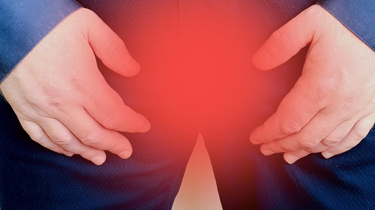 En mans skrev med röd markering. För att illustrera prostatacancer.