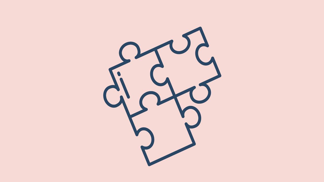 En pusselbit på en rosa bakgrund.