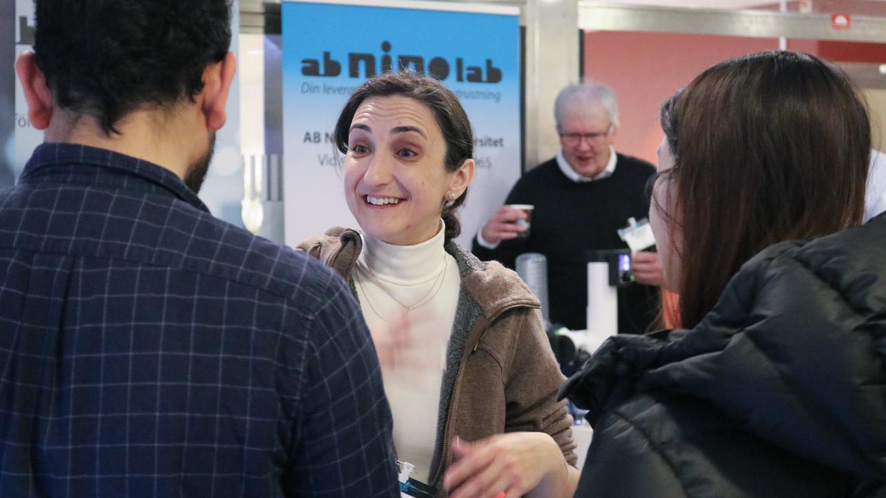 Group of people are standing at the conference venue and talking