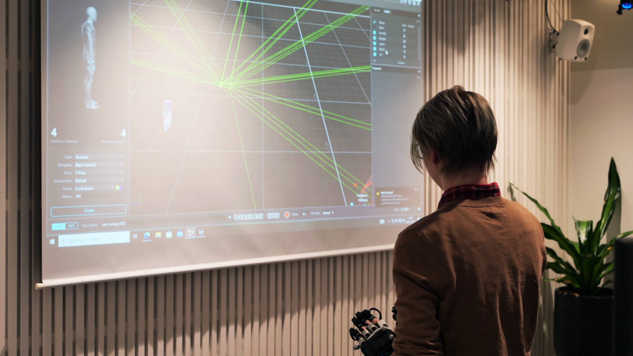 Screen displaying movements from person wearing Motion Capture equipment.