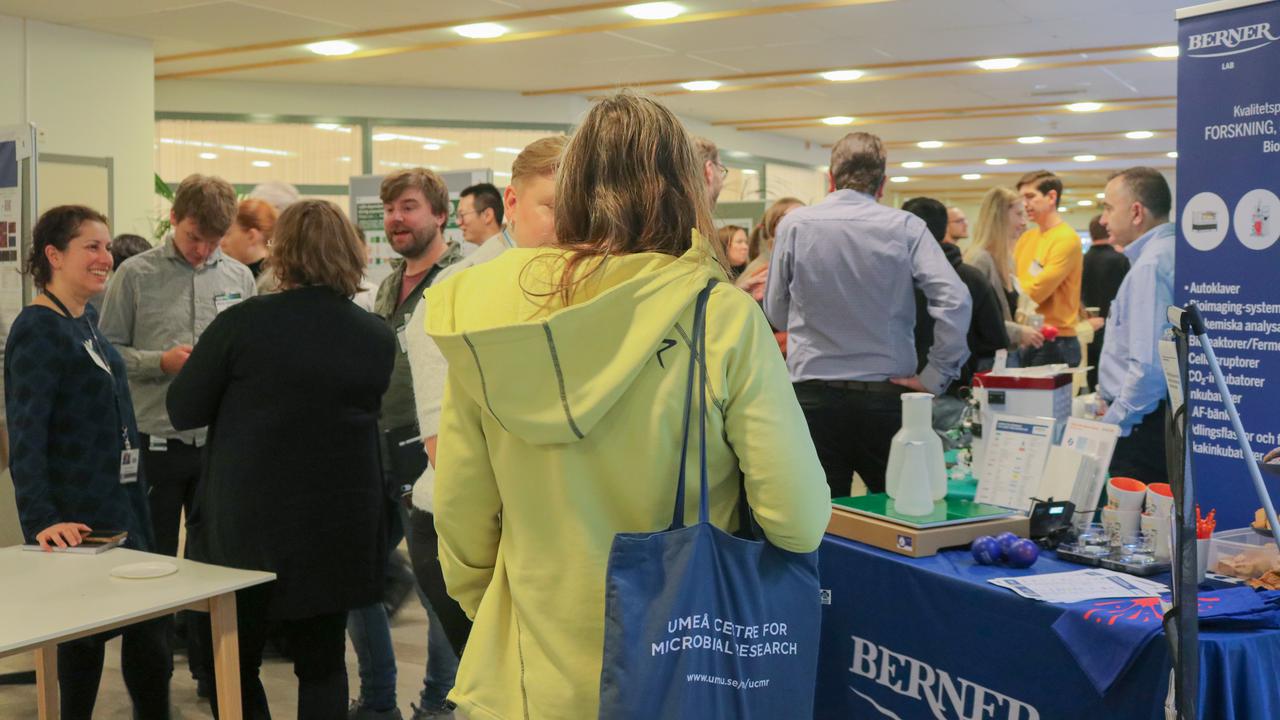 Two men in conversation during the poster session at the scientific conference