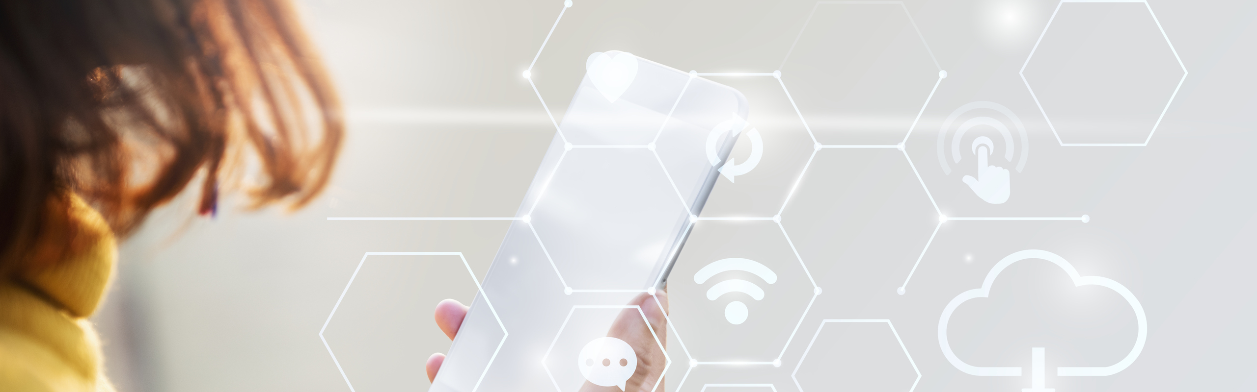 Bilden visar en mobiltelefon och tekniska ikoner.