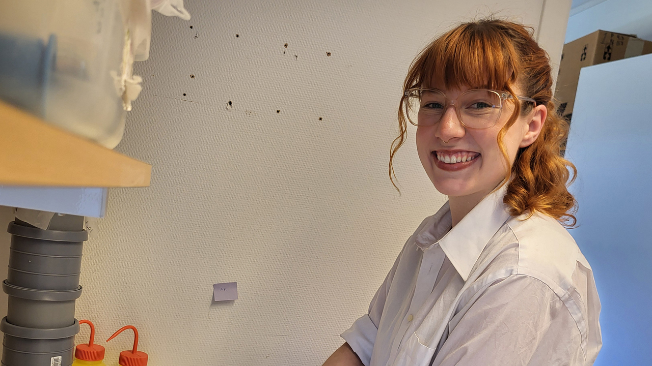 A young woman working in a laboratory.