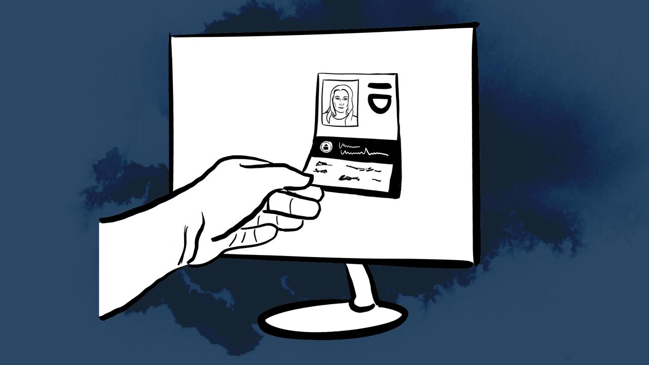 Hand plockar ut en identifikation från en dator.