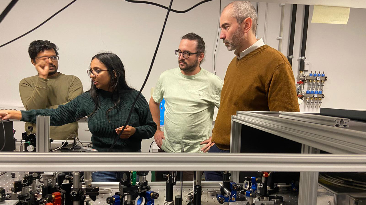 Researchers working on a laser