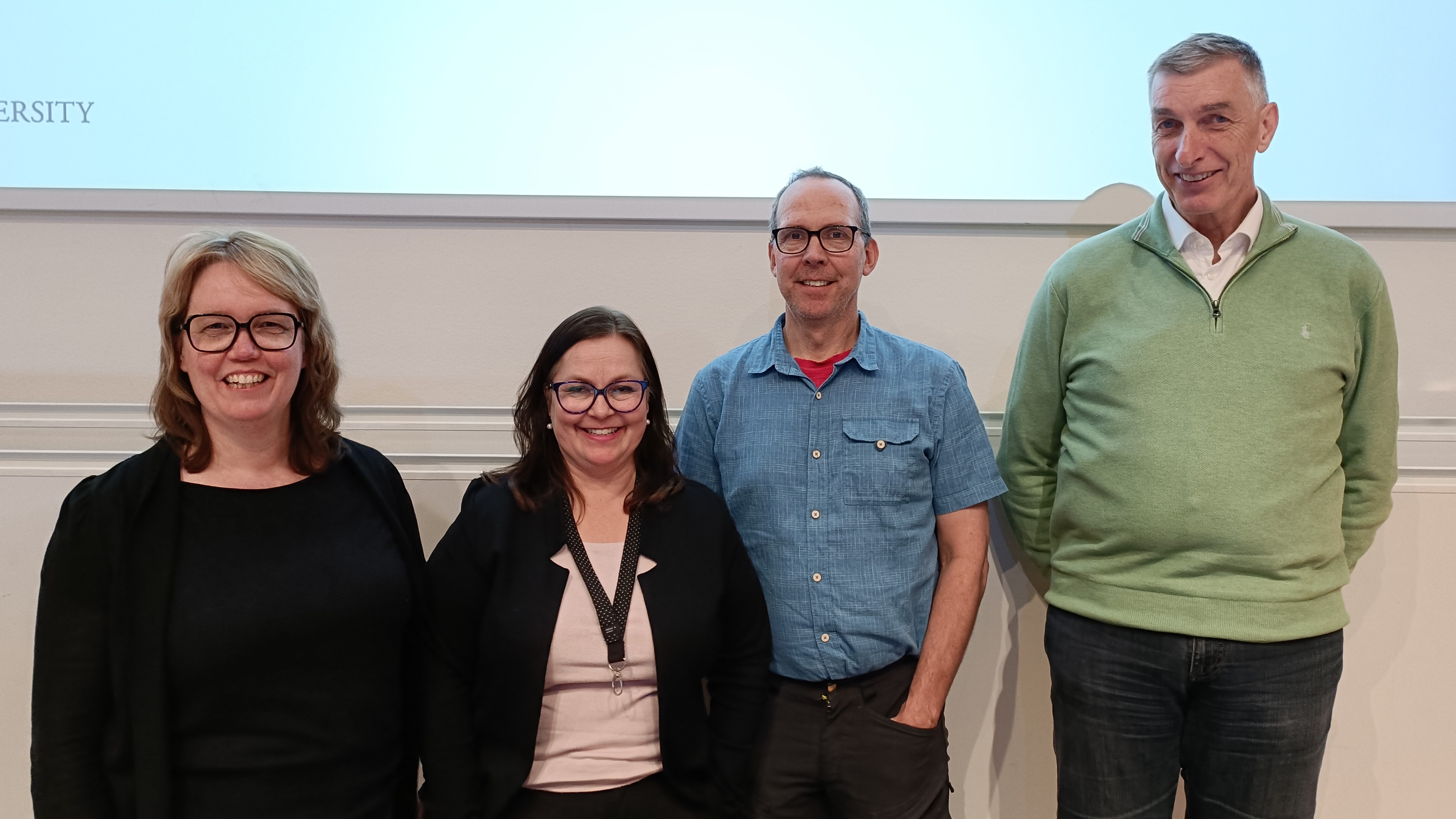 Annika Myrén, Annika Egan Sjölander, Keith Larson and Frank Dignum stand in front of a whiteboard
