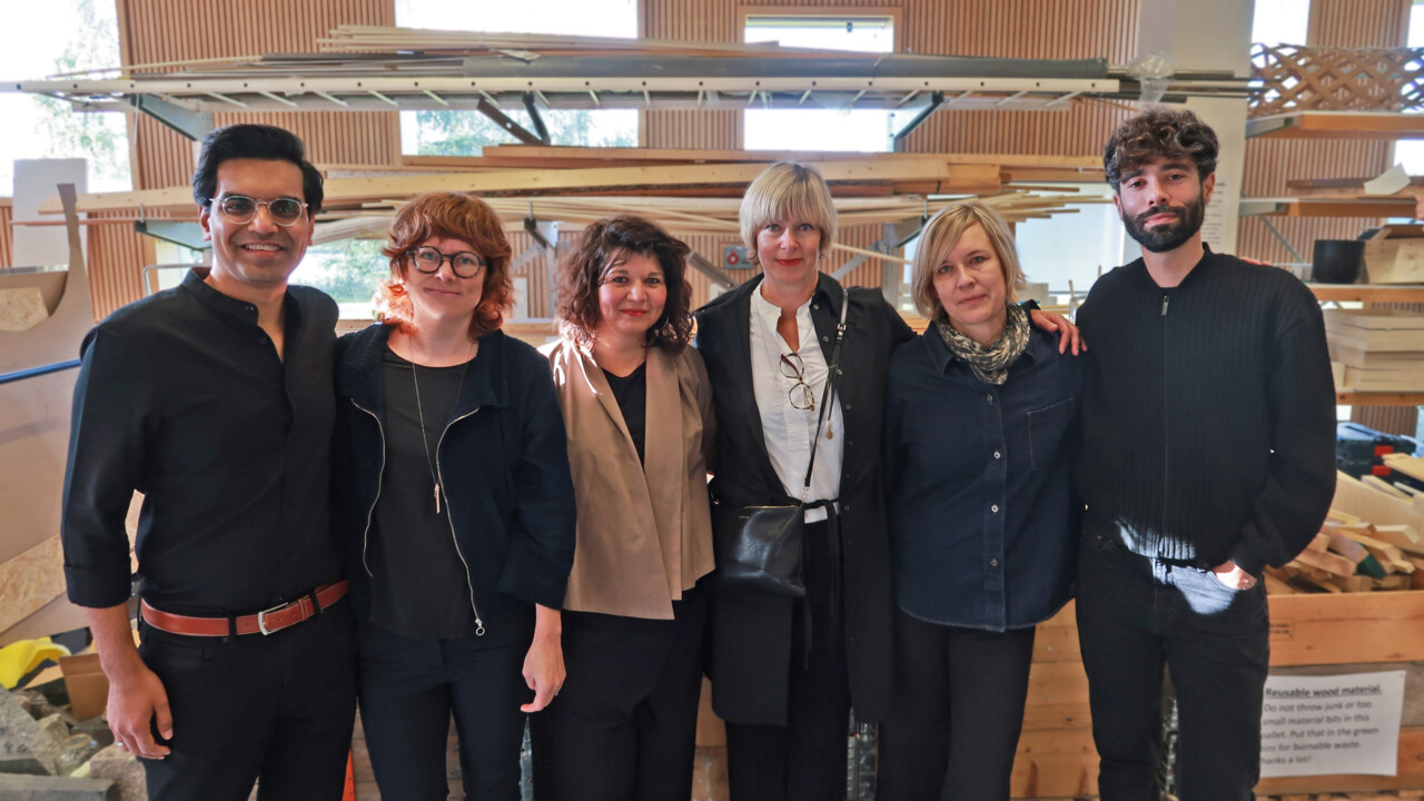 Image of the UMA Leadership team in architecture school workshop