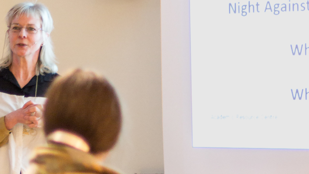 A woman gives a talk