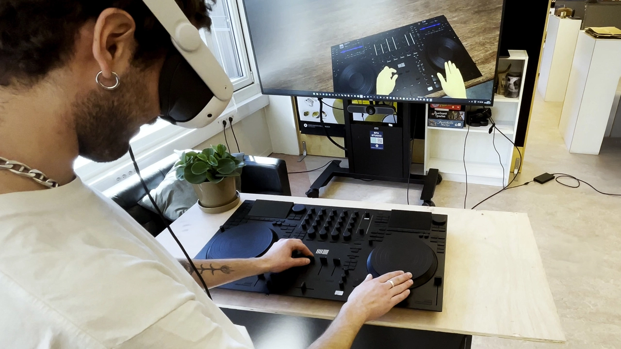 Hybrid testing setup using a physical controller model and VR headset. Users play on real hardware while immersed in a digital venue.