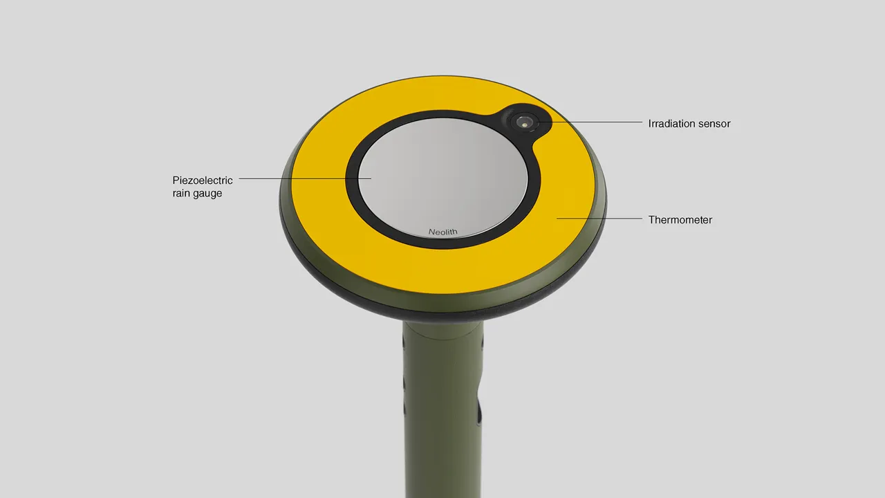 The top surface is equipped with additional sensors for measuring precipitation, temperature, and sunlight levels.