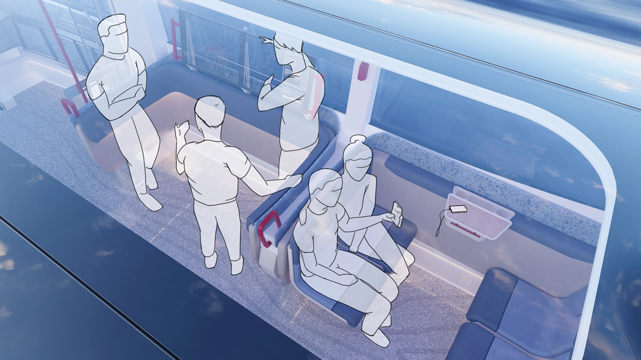 Passengers interacting with the information screen, looking at where they are travelling to.