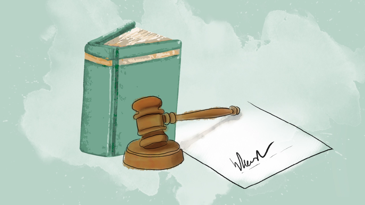 Law book, gavel and an agreement.