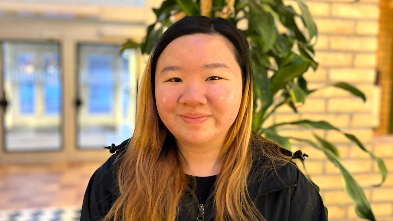 A female student inside one of the buildings on Campus Umeå. 