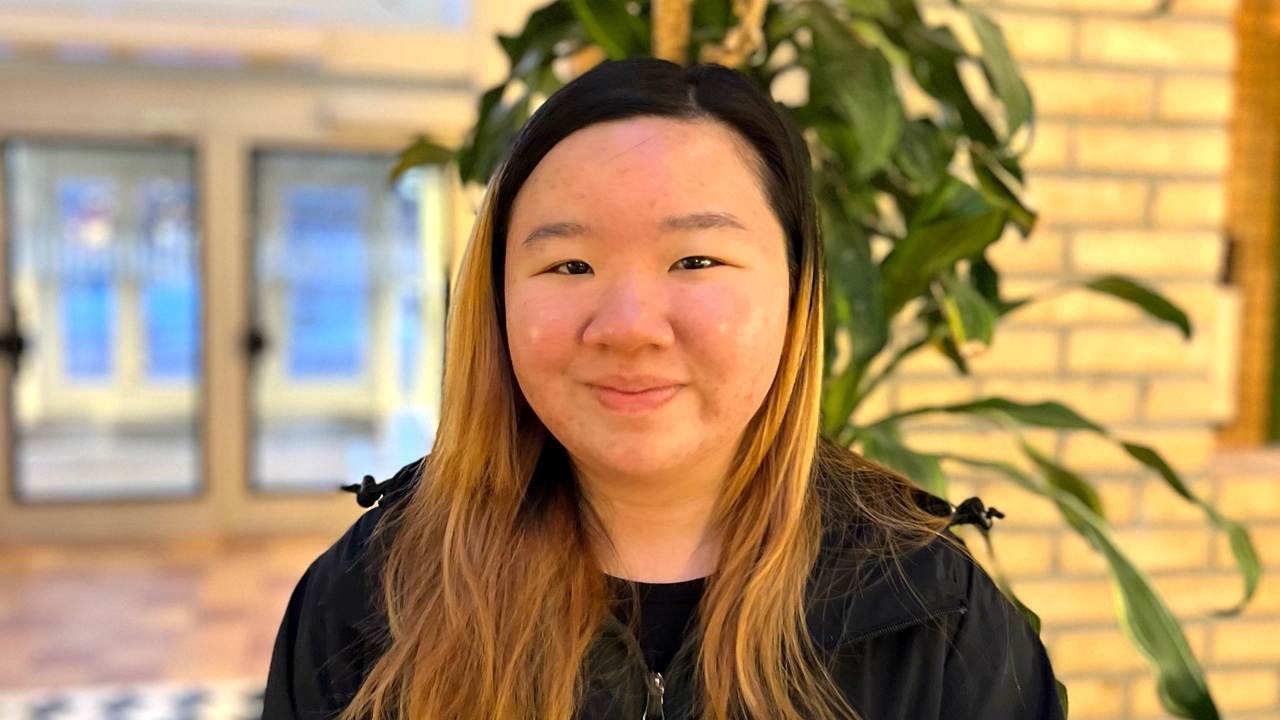 A female student inside one of the buildings on Campus Umeå. 