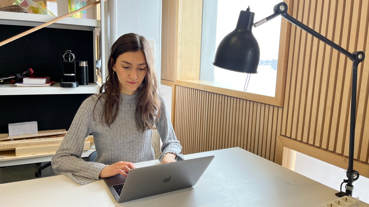 Photo of Emma Biondani working at her desk at Umeå School of Architecture