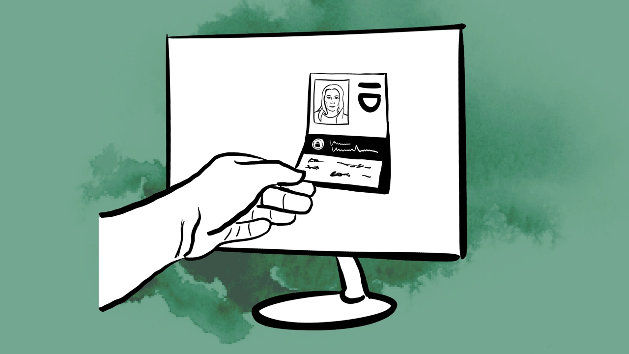A hand reaches over to take an ID card out of a screen.