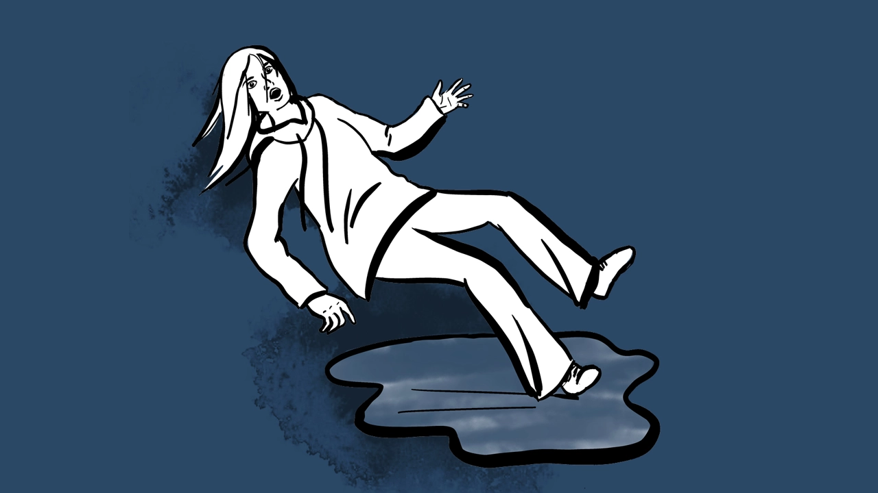 Woman slips on a patch of ice.