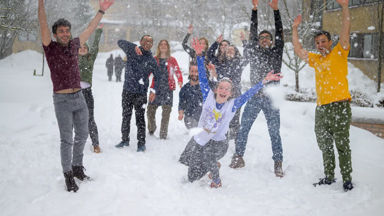 A group of people playing in the snow