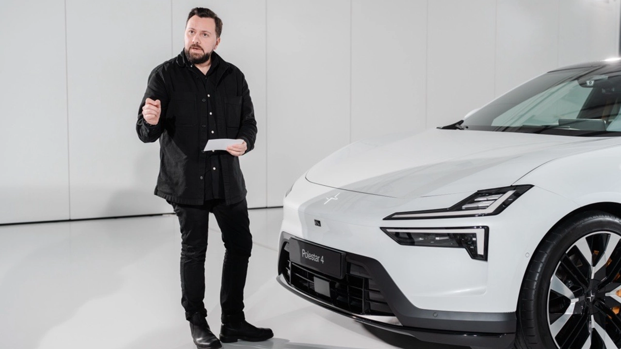 Photo of Juan Pablo Bernal standing in front of a white car