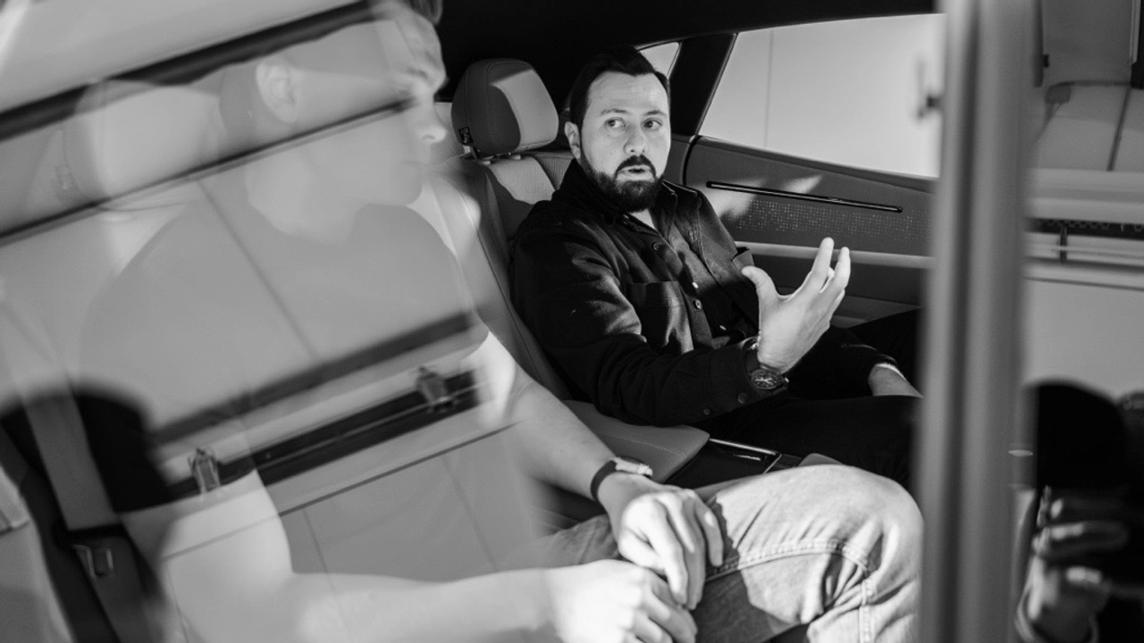 Photo of Juan Pablo Bernal sitting inside a car