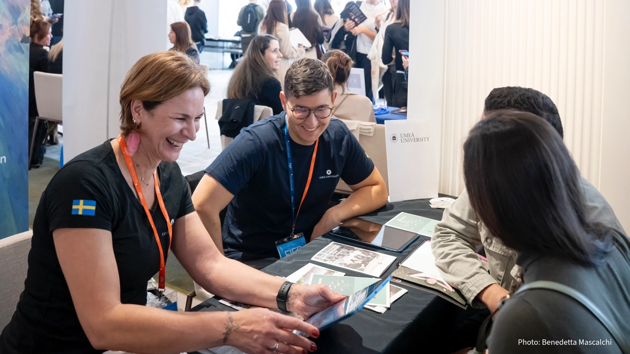 A group of people sitting around a table.