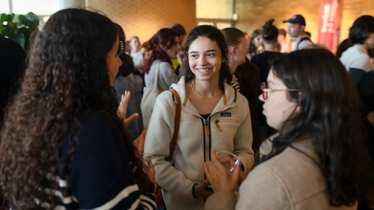 Three women in conversation.