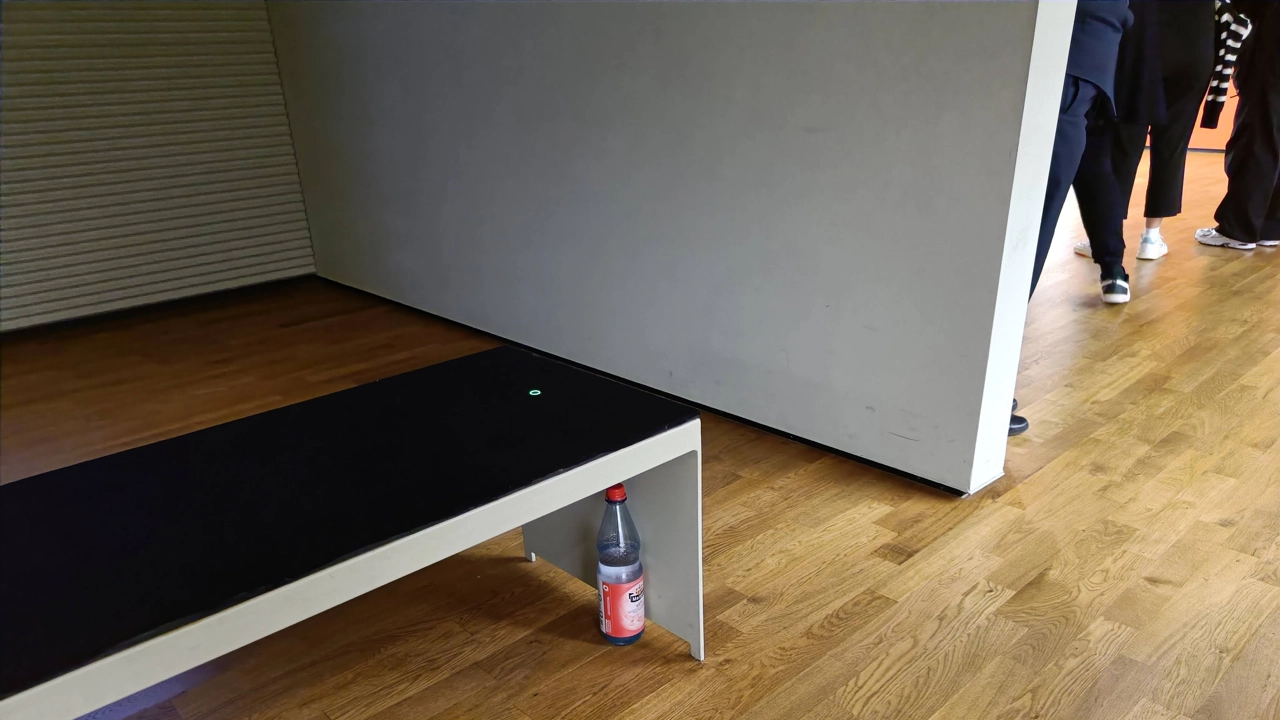 The water bottle in this image is only one of a few designed objects in this permanent design exhibition doing what it is designed to do: storing water and providing it to a gallery attendant as an act of care – keeping a human being alive. Museum visit, 2 Sep 2022