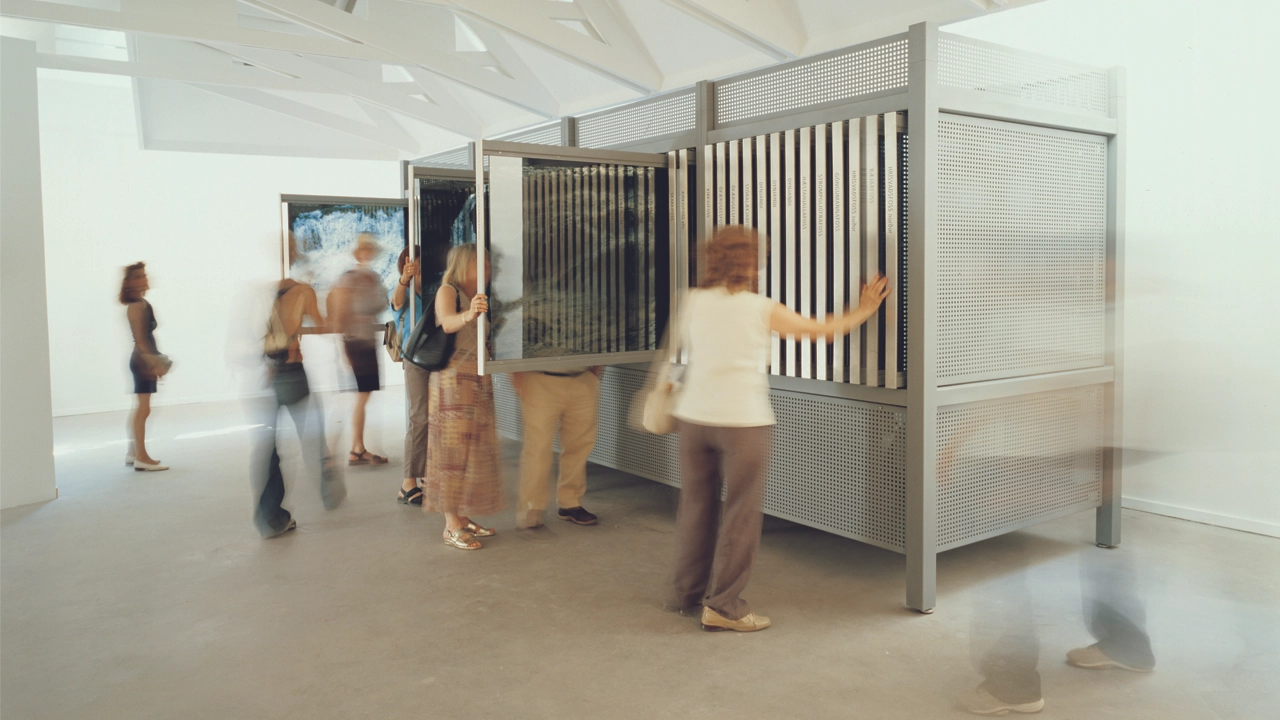 People in the move inside an art exhibition hall