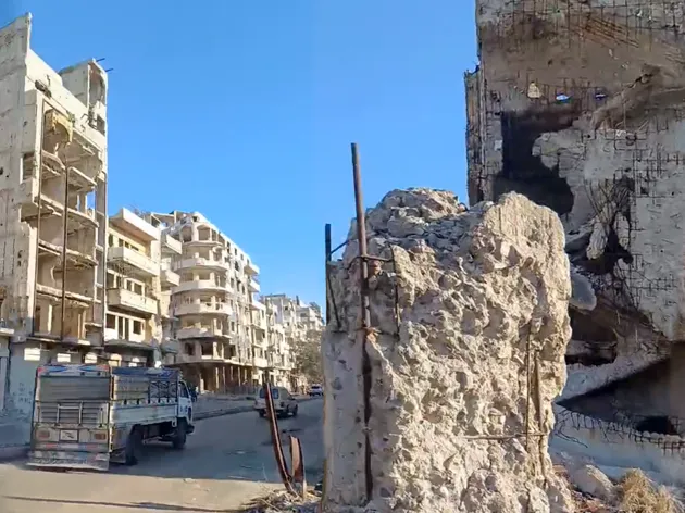 Torn/bombed buildings in city