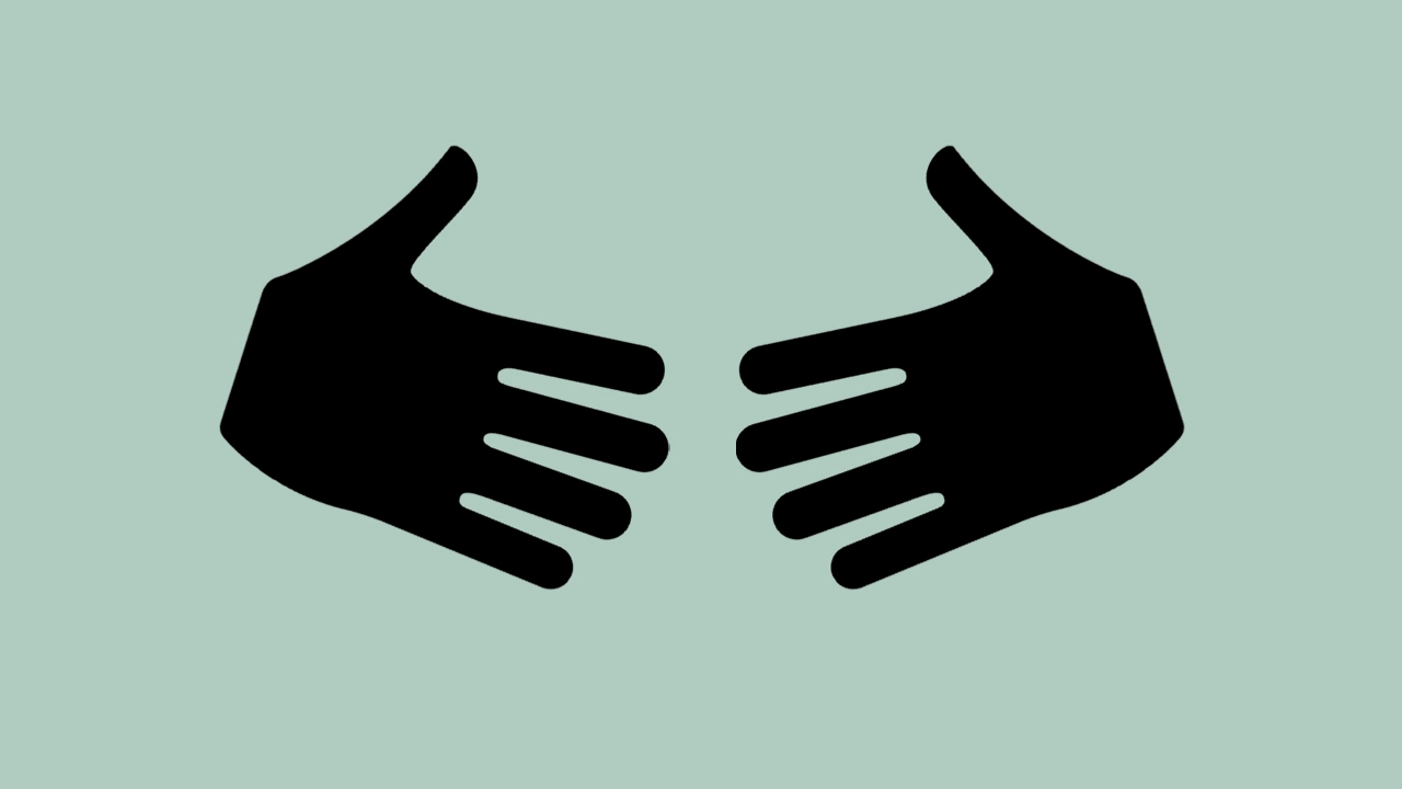 Två händer sträcks ut mot varandra.