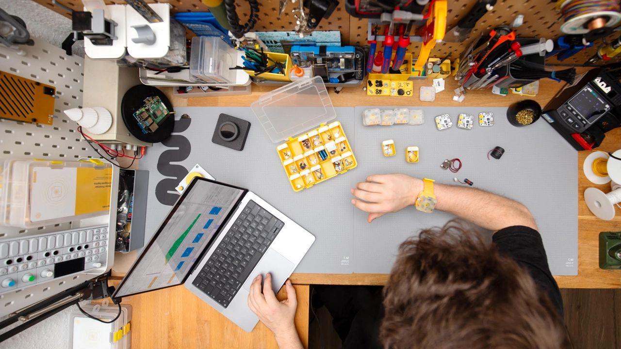 Photo of cluttered desk seen from above