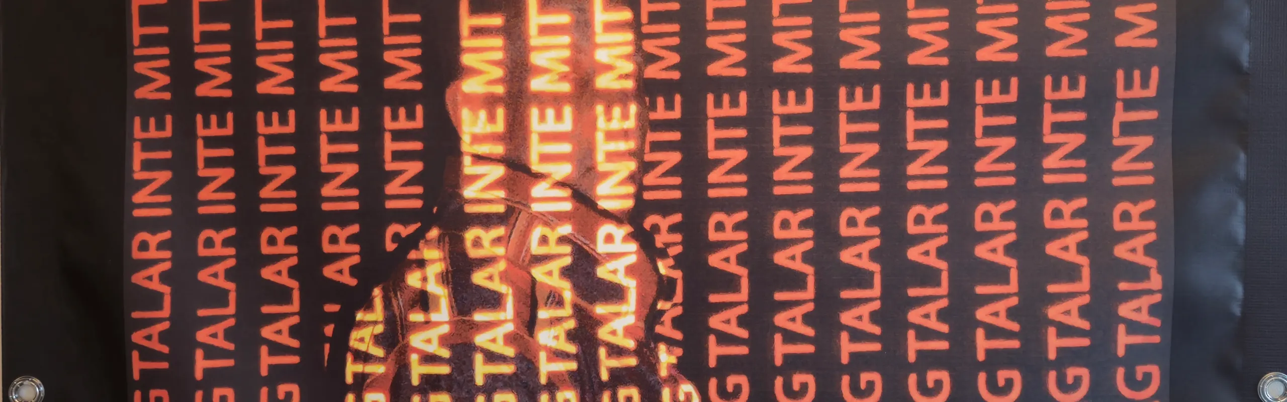 Poster with orange coloured text on black