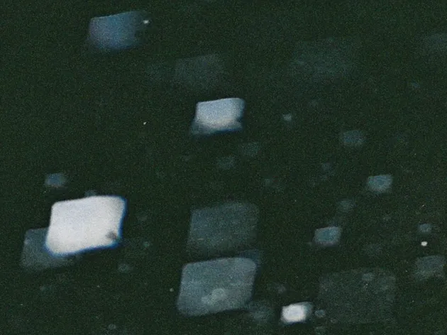 black abstract image with lighter reflections