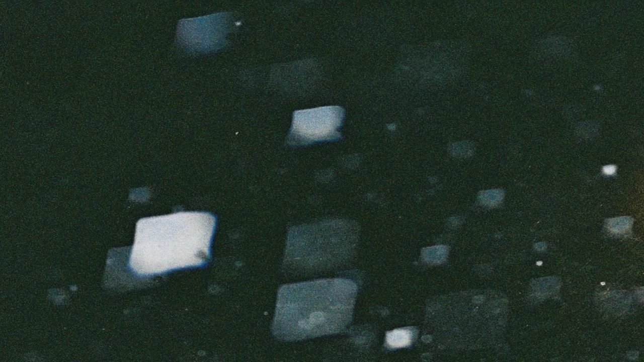 black abstract image with lighter reflections