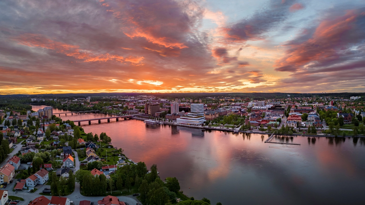 Overhead view of Umeå with a pink twilight sky.